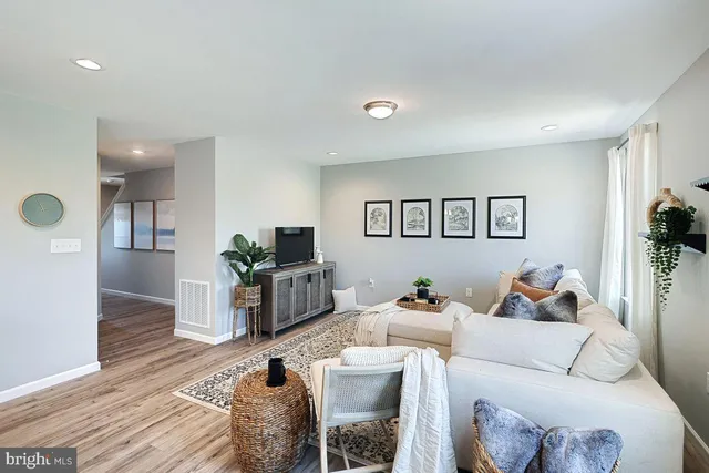 a bathroom with a sink a toilet a mirror and shower