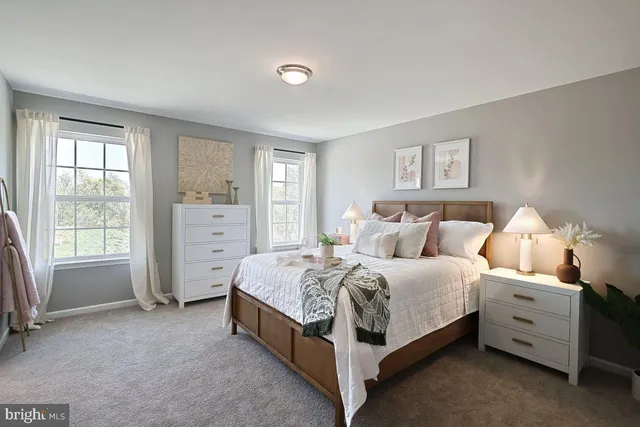 a bedroom with a bed and a mirror