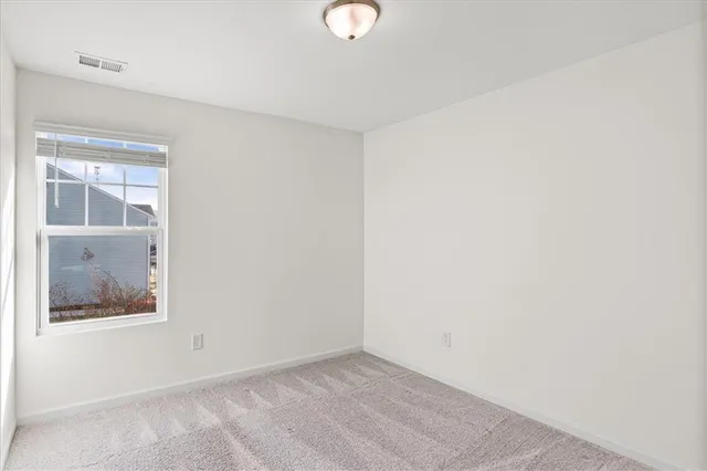 a view of an empty room with window