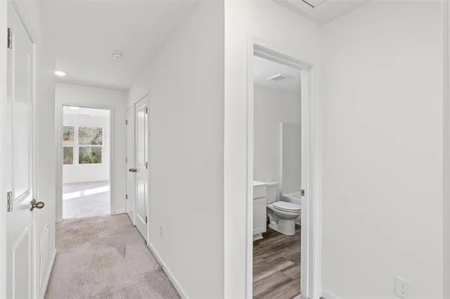 a view of bathroom with a toilet sink and a shower