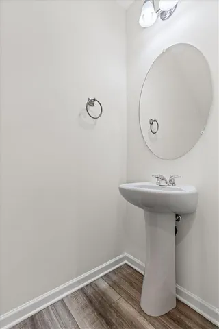 a bathroom with a sink and mirror