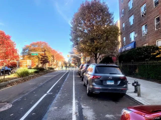 a view of a street with cars on road
