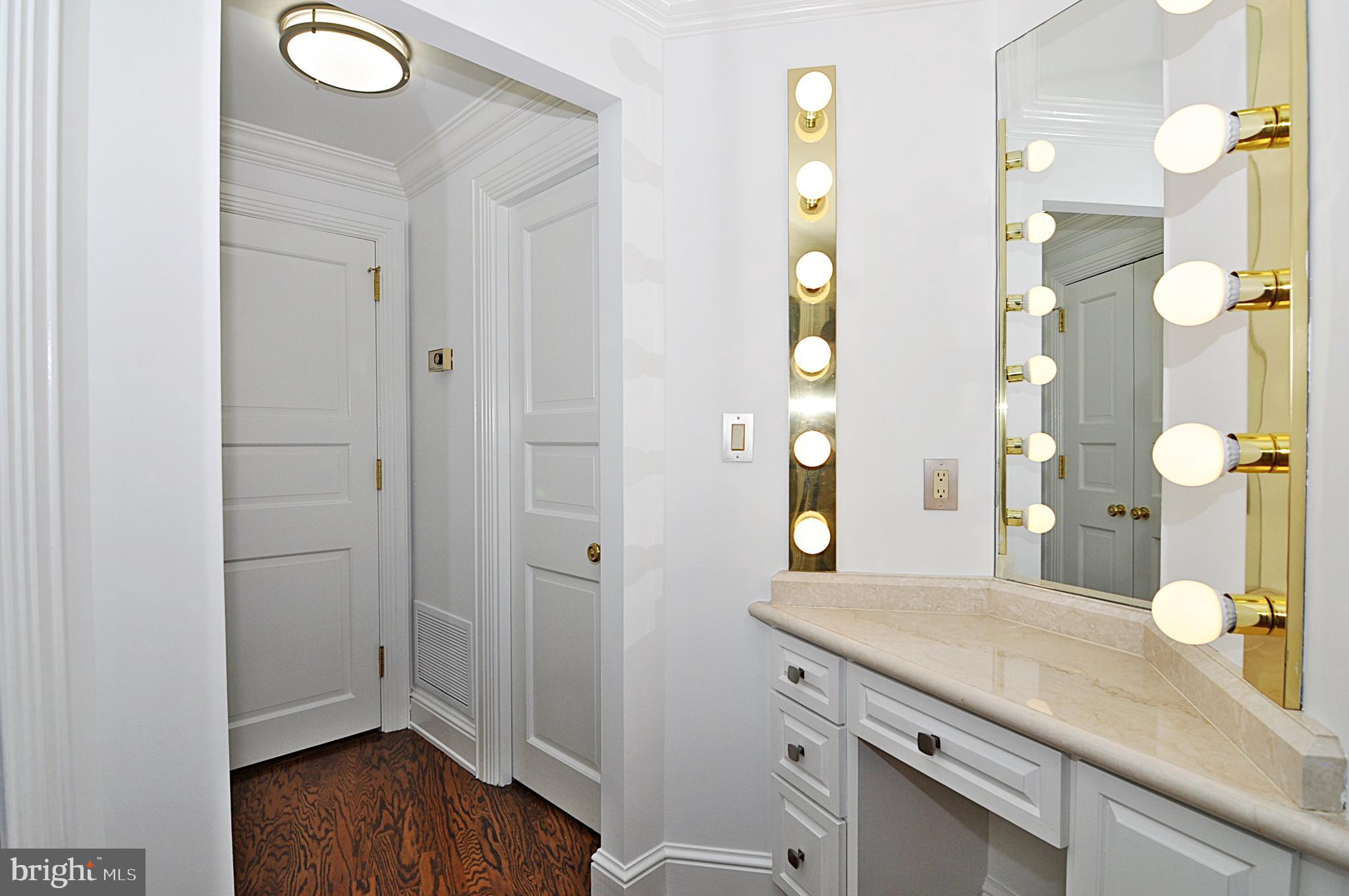3030 K Street Northwest, Unit 204 Washington, DC 20007 - Photo 16 of 34 a bathroom with a granite countertop sink a mirror and a shower