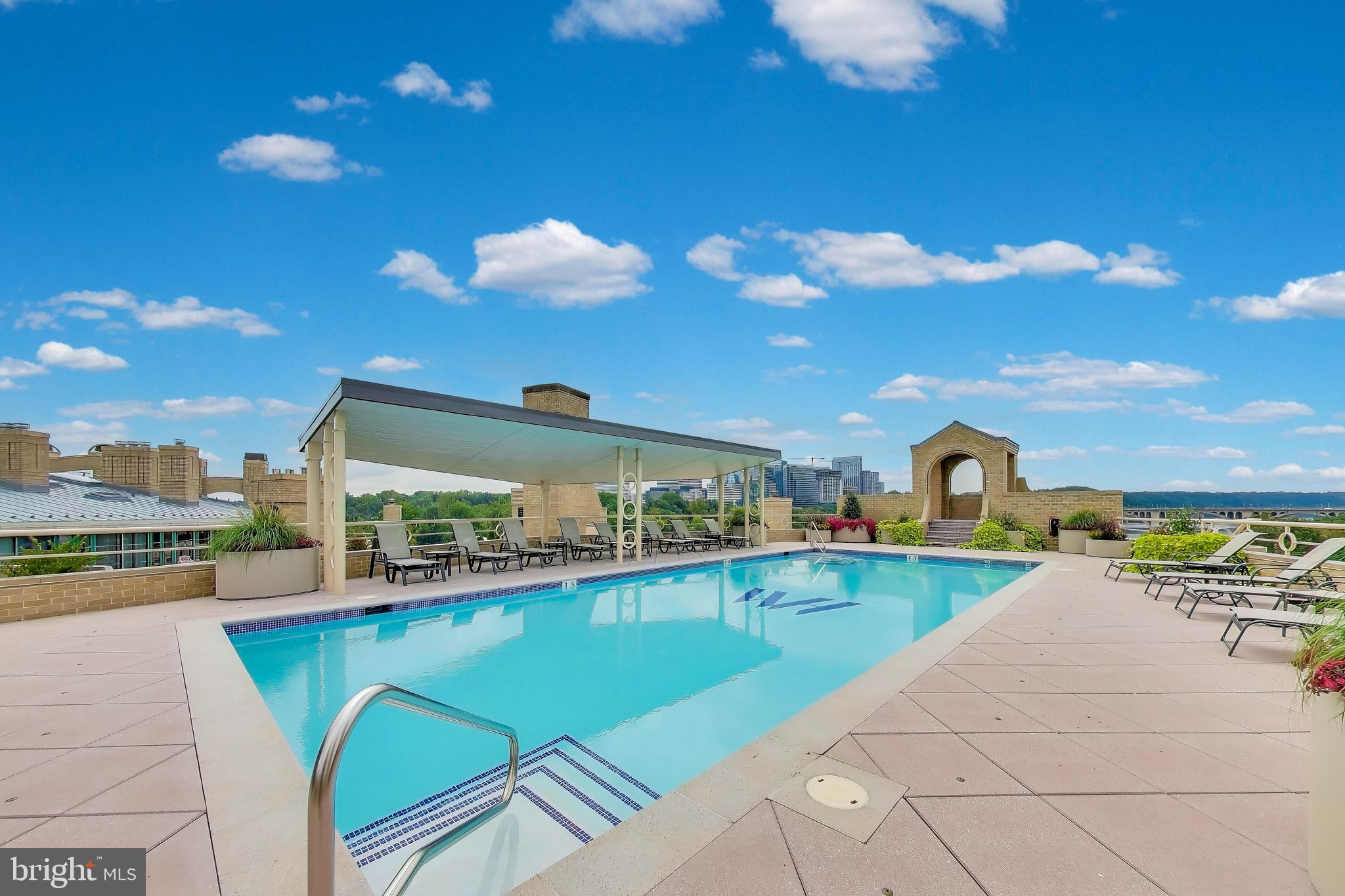 3030 K Street Northwest, Unit 204 Washington, DC 20007 - Photo 26 of 34 a view of a swimming pool with a patio