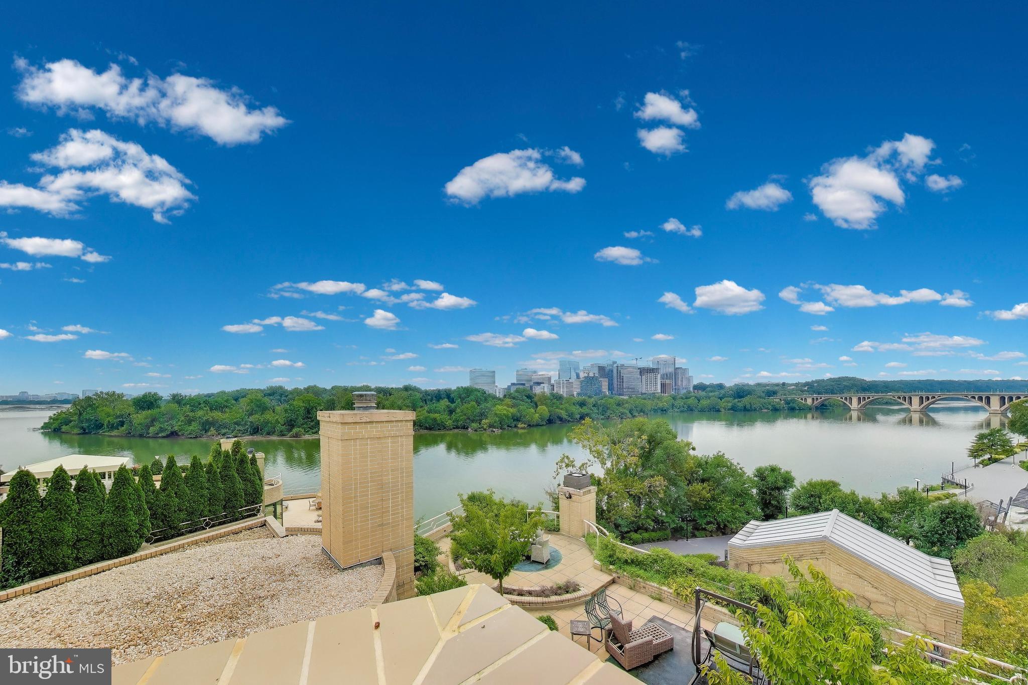 3030 K Street Northwest, Unit 204 Washington, DC 20007 - Photo 27 of 34 a night view of a lake with a garden and a yard