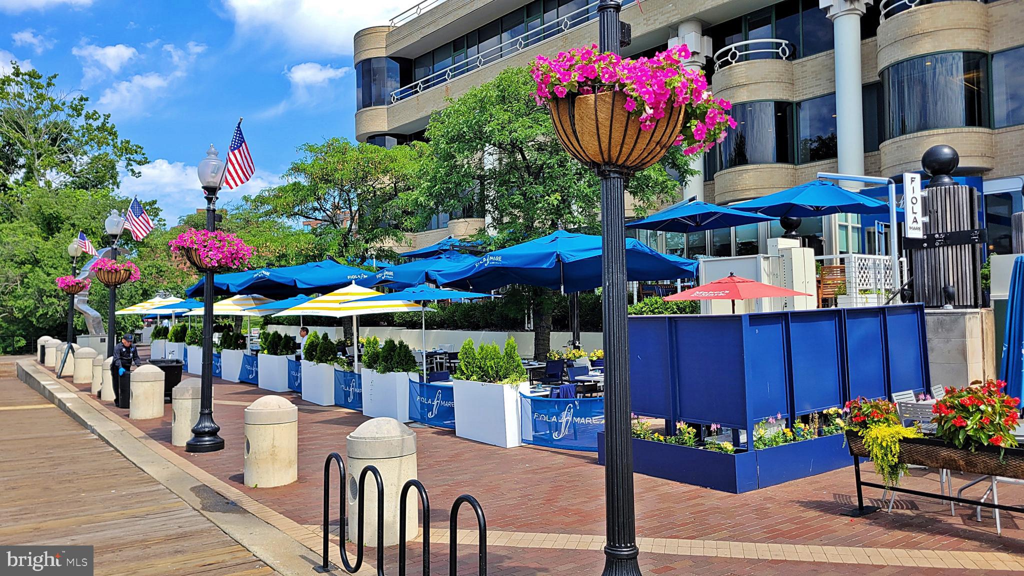 3030 K Street Northwest, Unit 204 Washington, DC 20007 - Photo 32 of 34 a view of a chairs and table in patio with a barbeque