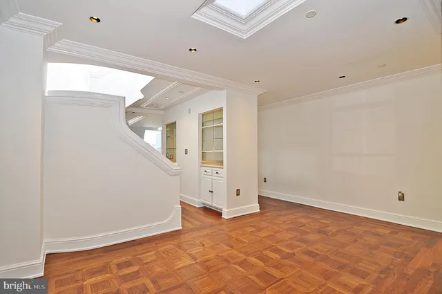 a kitchen with granite countertop cabinets and window