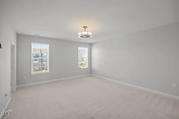a view of empty room with windows