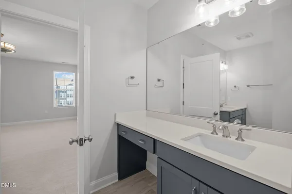 a bathroom with a sink double vanity and a mirror