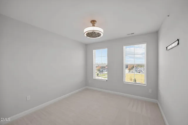 a bathroom with a sink a toilet and a large mirror