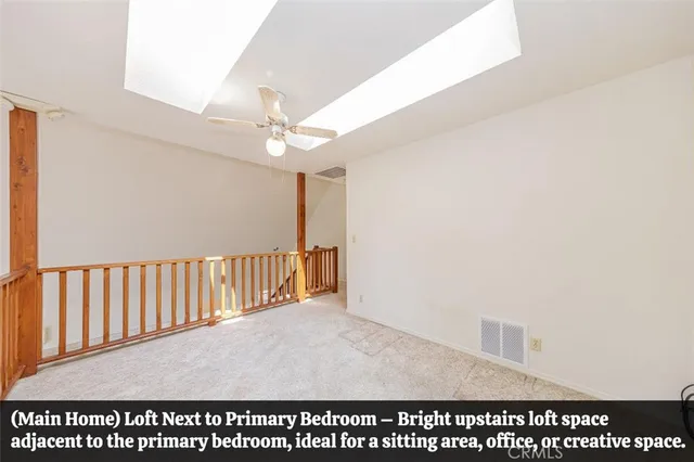 a view of a kitchen with granite countertop cabinets and refrigerator