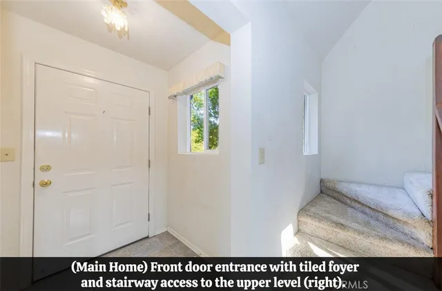 a view of a kitchen with a sink and dishwasher next to a window
