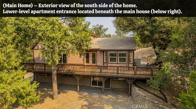 a view of a house with wooden deck and sitting space
