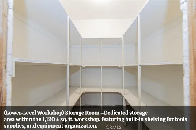 an empty room with window and ceiling fan