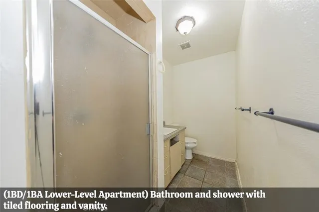 a bathroom with a sink a mirror and next to a window