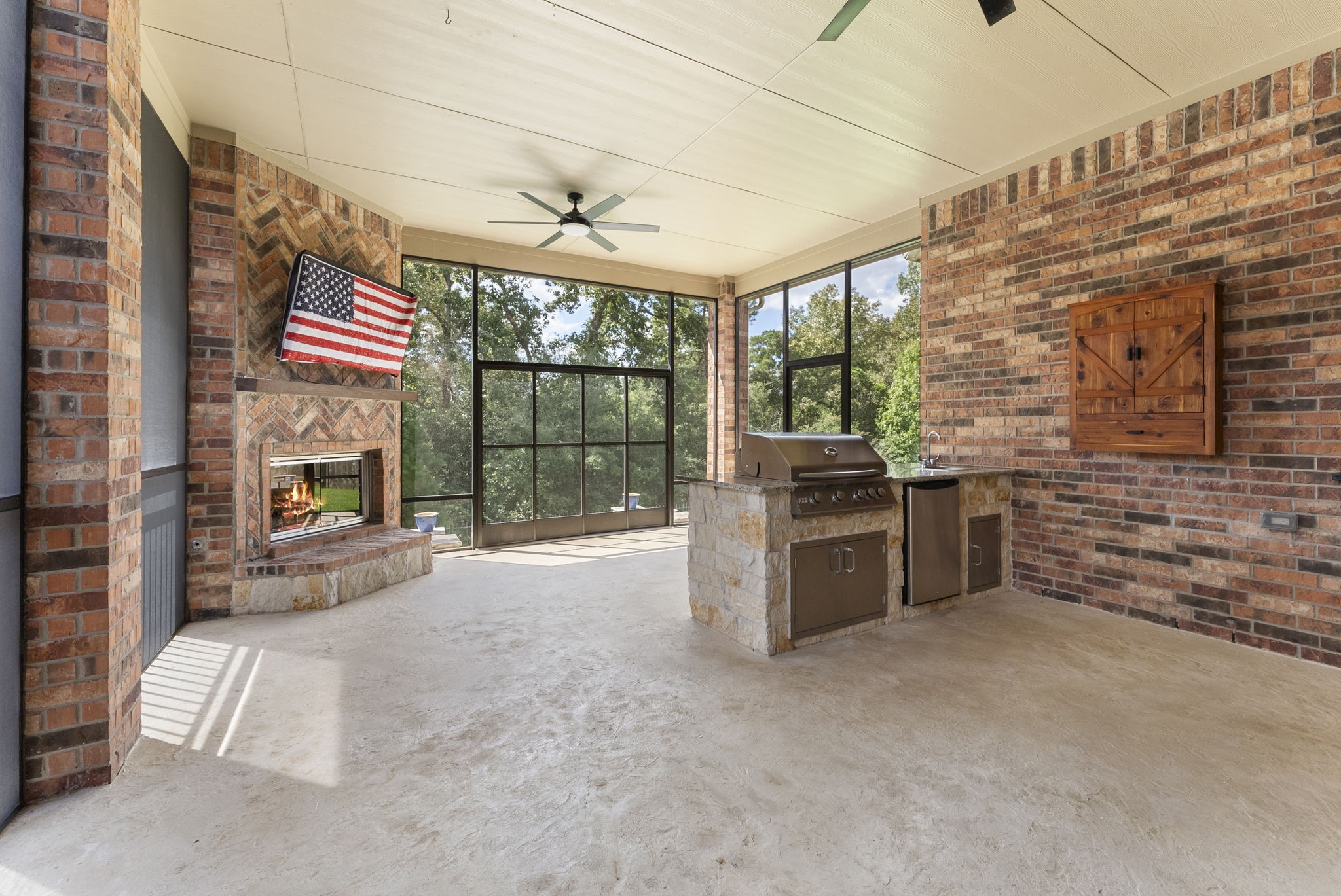 3565 Falcon Way Conroe, TX 77304 - Photo 41 of 50 Outdoor kitchen featuring built-in stainless-steel grill and beverage refrigerator.