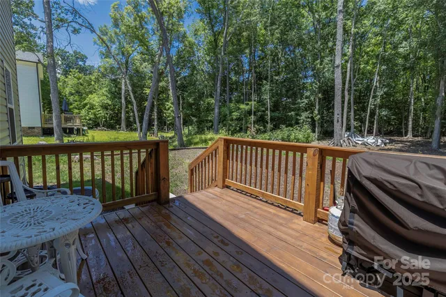 a view of a wooden deck with a large window