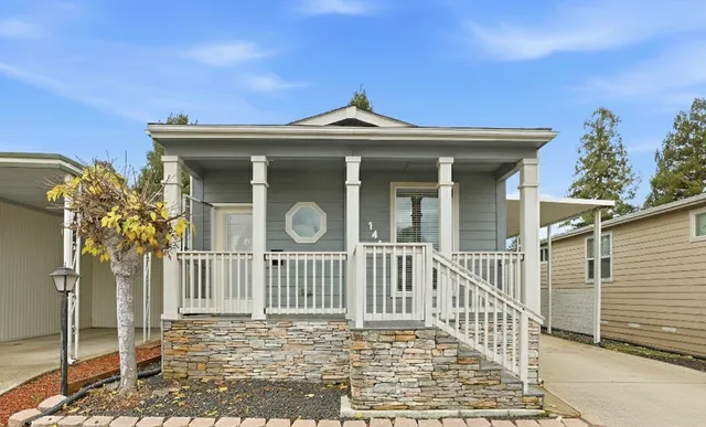 a front view of a house with a porch