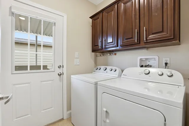 a utility room with dryer and washer