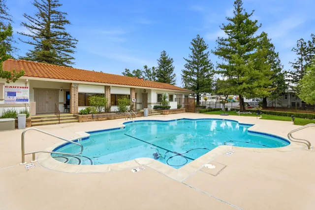a view of a house with swimming pool