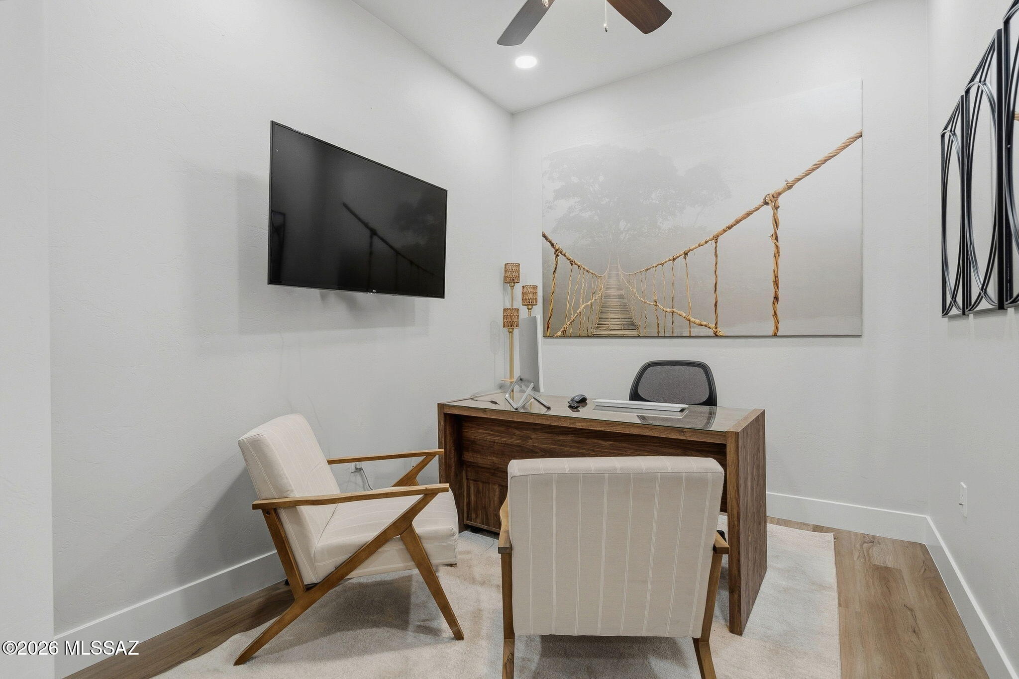 2020 East River Road, Unit 101 Tucson, AZ 85718 - Photo 7 of 12 a living room with furniture and a flat screen tv