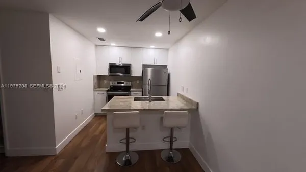 a view of a workspace with furniture