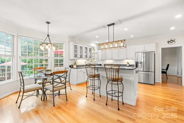 a view of a dining room with furniture window and wooden floor