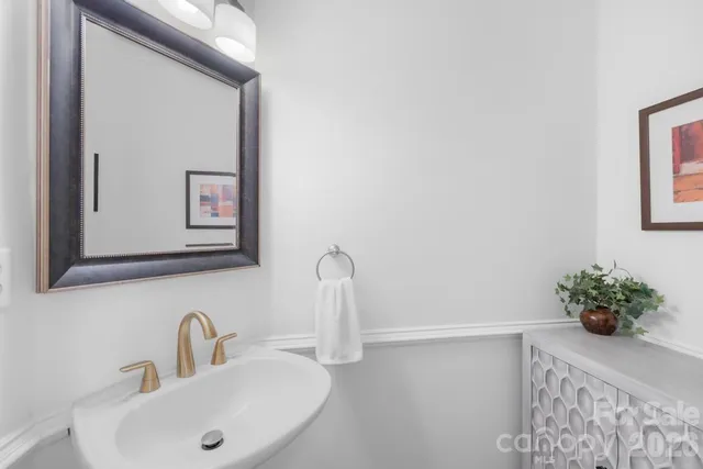 an aerial view of a house with pool yard and outdoor seating