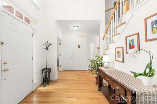 a kitchen with stainless steel appliances granite countertop a stove and more cabinets