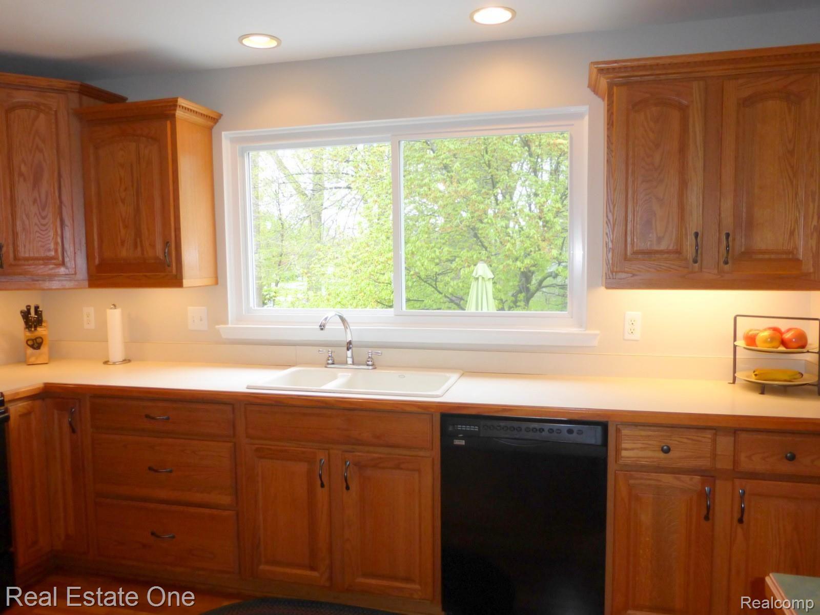 645 Hidden Ridge Drive Troy, MI 48083 - Photo 6 of 43 Kitchen window looks out over private backyard
