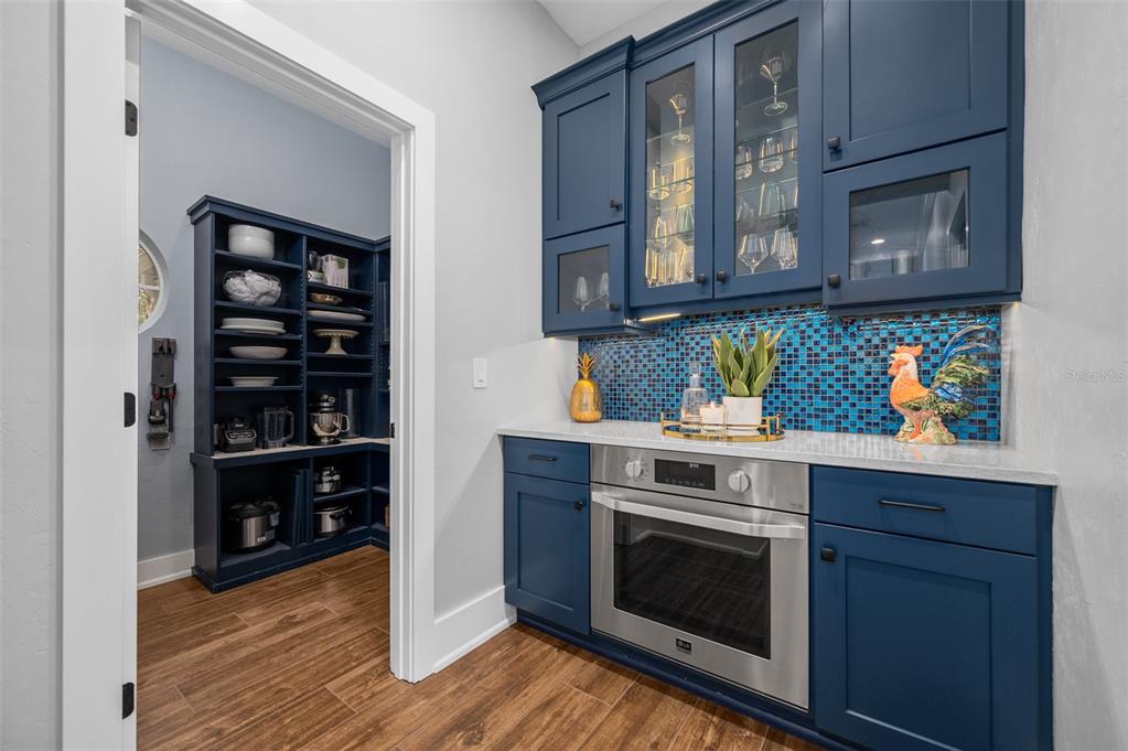 4524 Southwest 105th Drive Gainesville, FL 32608 - Photo 22 of 56 a kitchen with stainless steel appliances a stove and cabinets