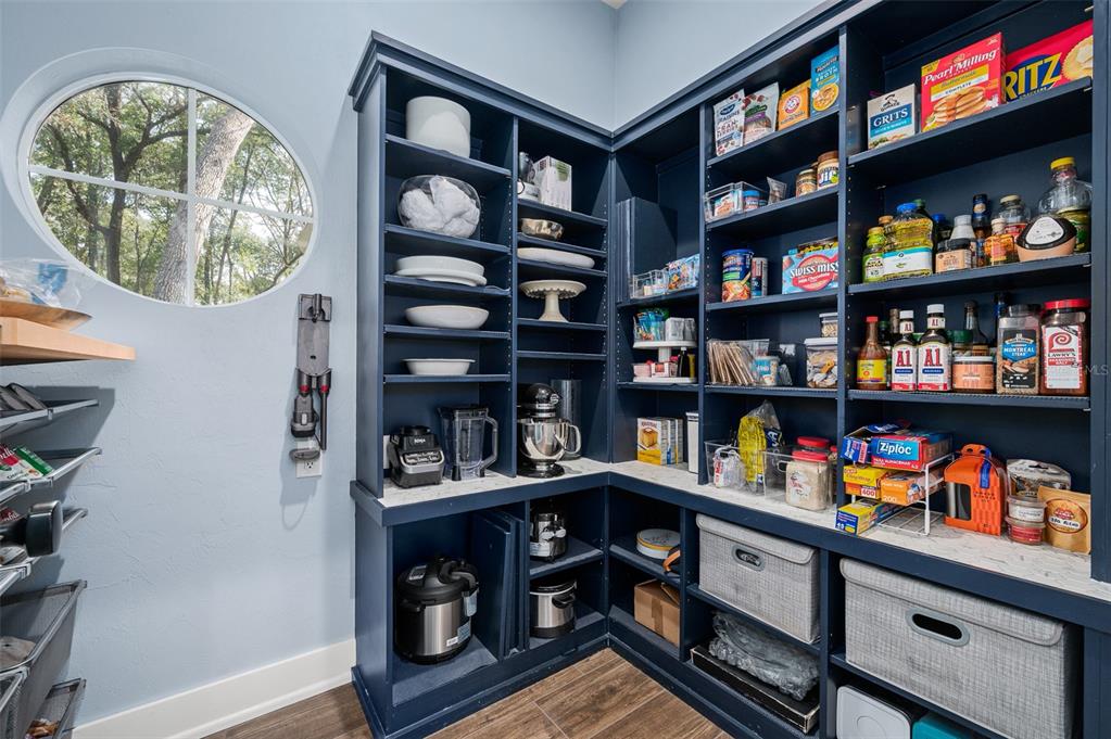 4524 Southwest 105th Drive Gainesville, FL 32608 - Photo 23 of 56 a room with furniture and a book shelf