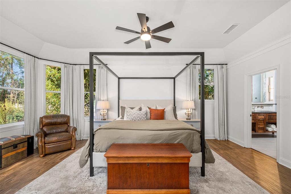 4524 Southwest 105th Drive Gainesville, FL 32608 - Photo 27 of 56 a bedroom with furniture and a large window