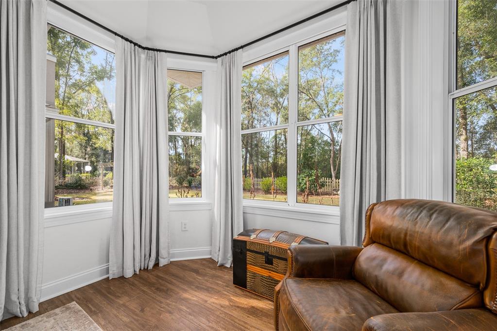 4524 Southwest 105th Drive Gainesville, FL 32608 - Photo 29 of 56 a living room with furniture and a window