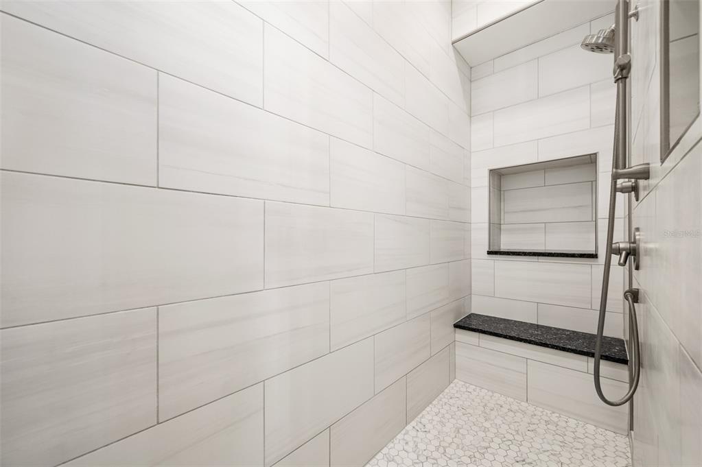 4524 Southwest 105th Drive Gainesville, FL 32608 - Photo 34 of 56 a bathroom with a glass shower