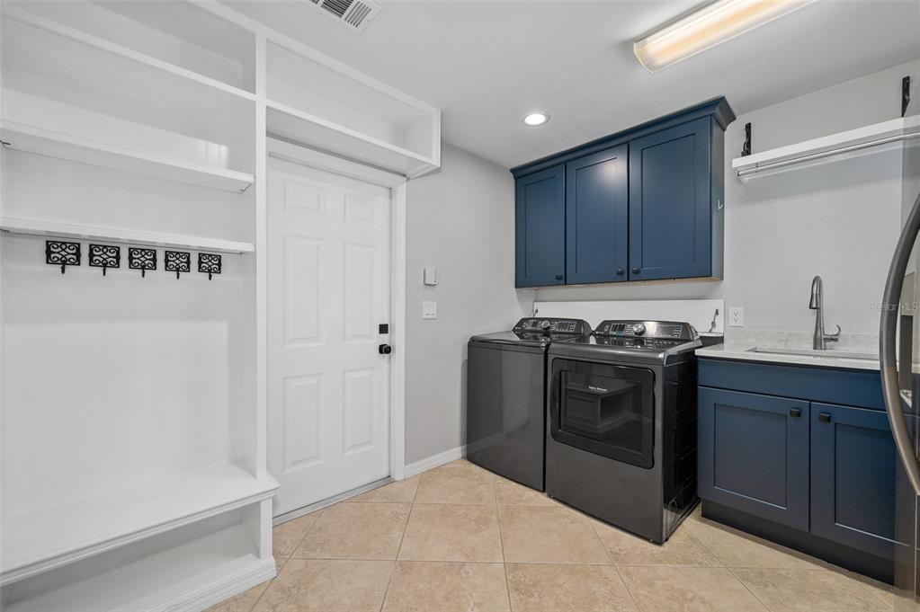 4524 Southwest 105th Drive Gainesville, FL 32608 - Photo 40 of 56 a kitchen with stainless steel appliances granite countertop a stove and a refrigerator