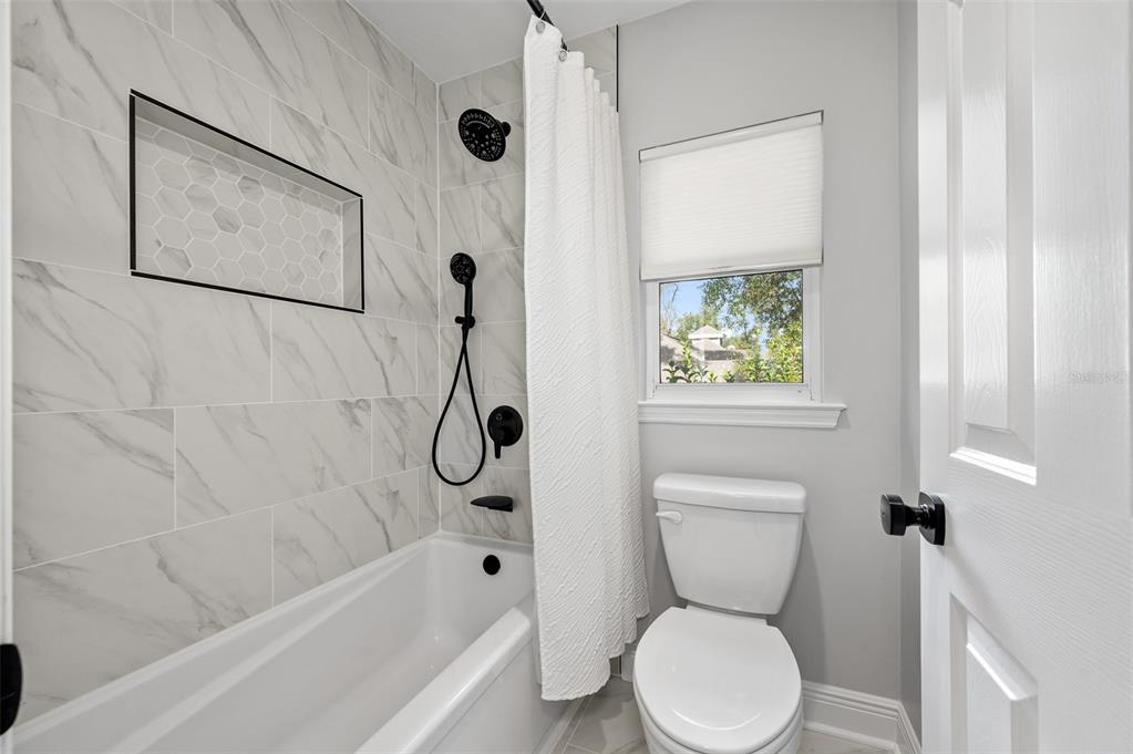 4524 Southwest 105th Drive Gainesville, FL 32608 - Photo 46 of 56 a bathroom with a toilet and a shower