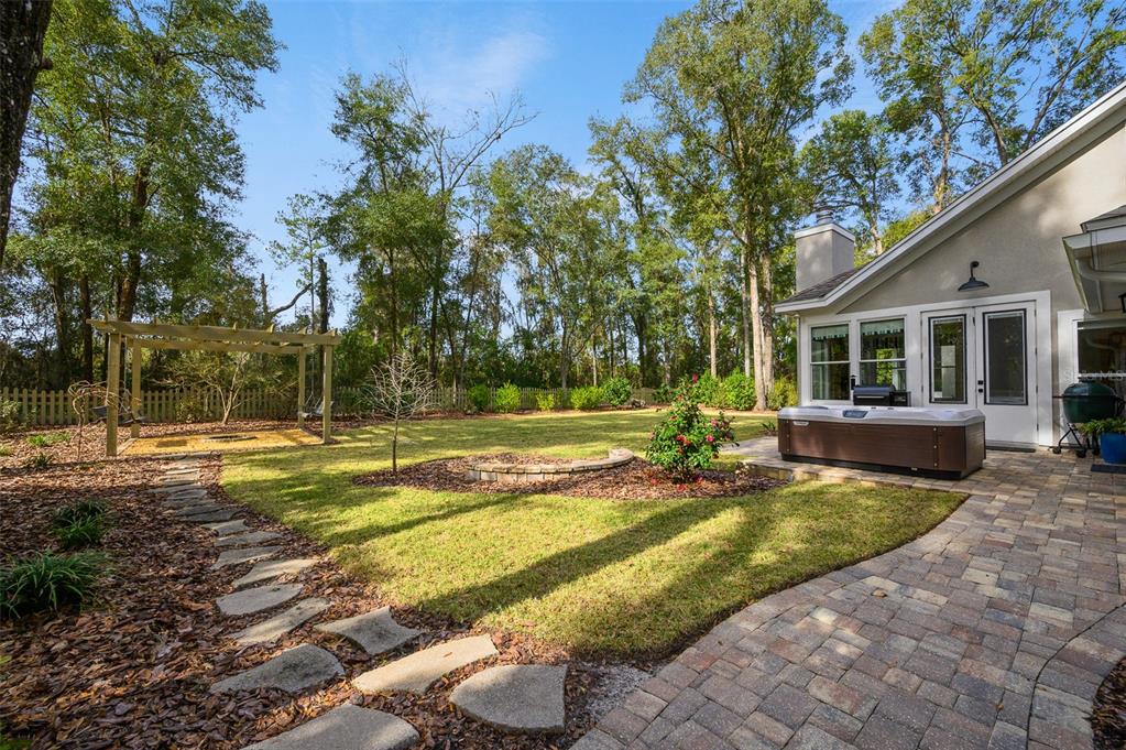 4524 Southwest 105th Drive Gainesville, FL 32608 - Photo 56 of 56 a view of a house with swimming pool and sitting area