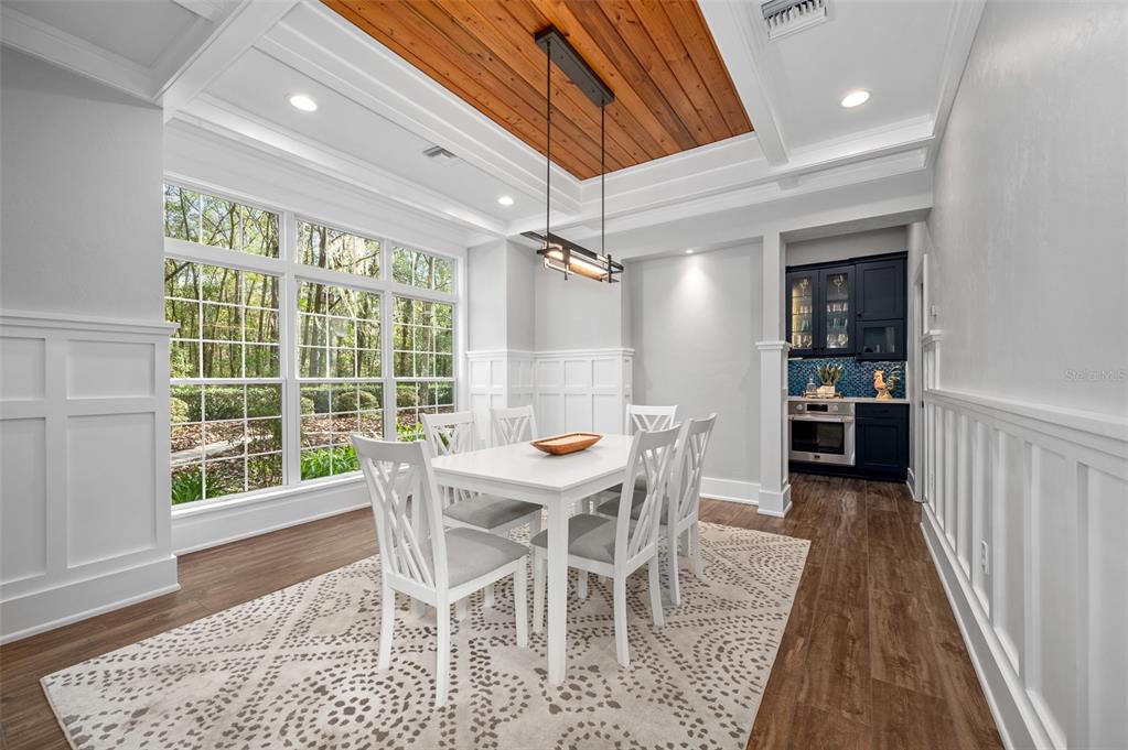 4524 Southwest 105th Drive Gainesville, FL 32608 - Photo 7 of 56 a view of a dining room with furniture window and wooden floor