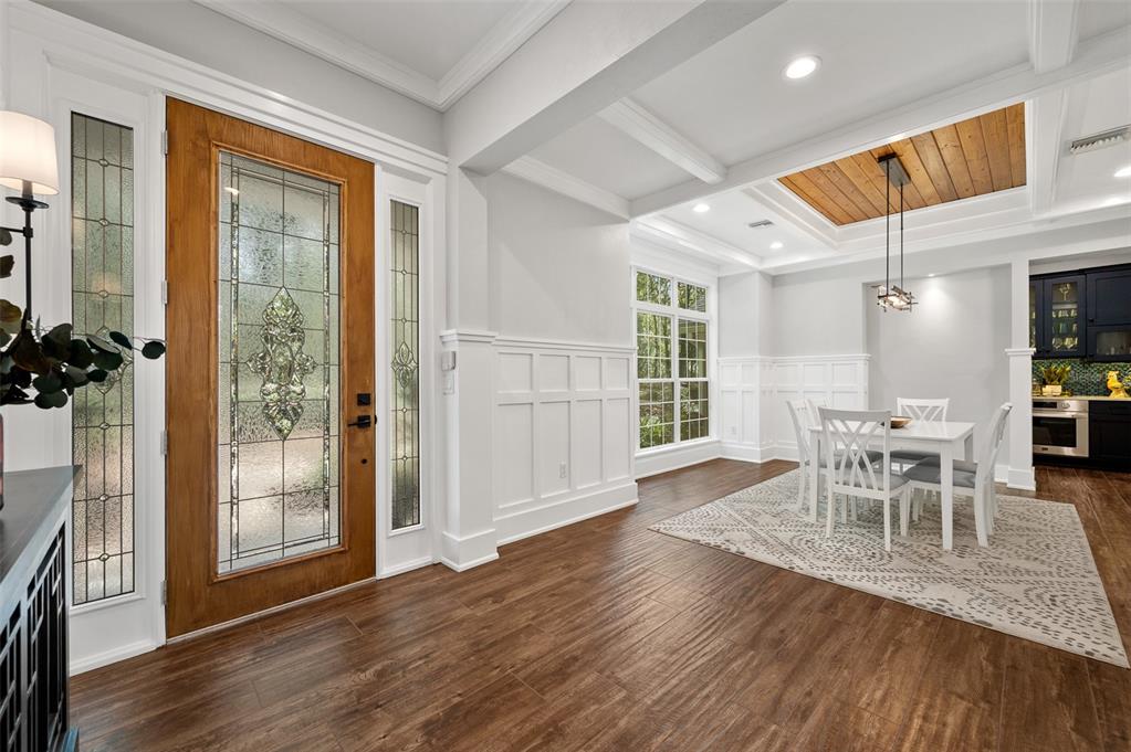 4524 Southwest 105th Drive Gainesville, FL 32608 - Photo 8 of 56 a view of a dining room with furniture and wooden floor