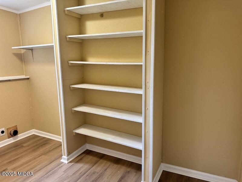 4912 Old Gordon Road Dry Branch, GA 31020 - Photo 12 of 32 a view of an empty room with wooden floor and a window