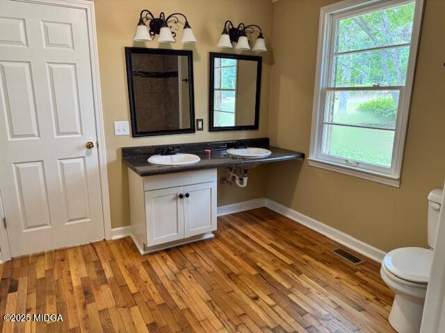 4912 Old Gordon Road Dry Branch, GA 31020 - Photo 19 of 32 a bathroom with a sink and a toilet
