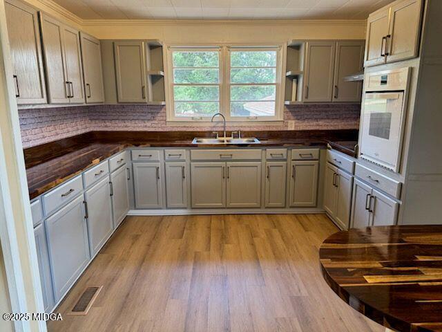 4912 Old Gordon Road Dry Branch, GA 31020 - Photo 2 of 32 a kitchen with a sink stove and refrigerator