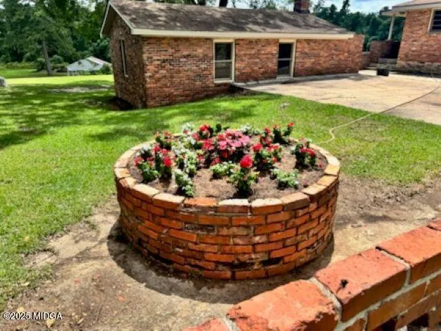 a view of a house with a garden