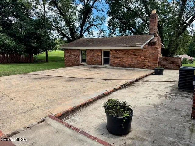 a view of a house with a garden