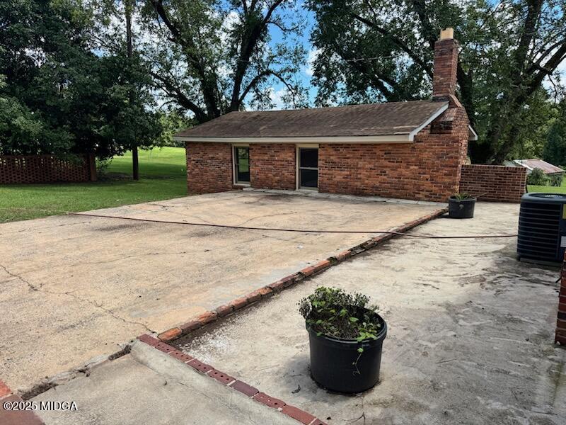 4912 Old Gordon Road Dry Branch, GA 31020 - Photo 24 of 32 a view of a house with a garden