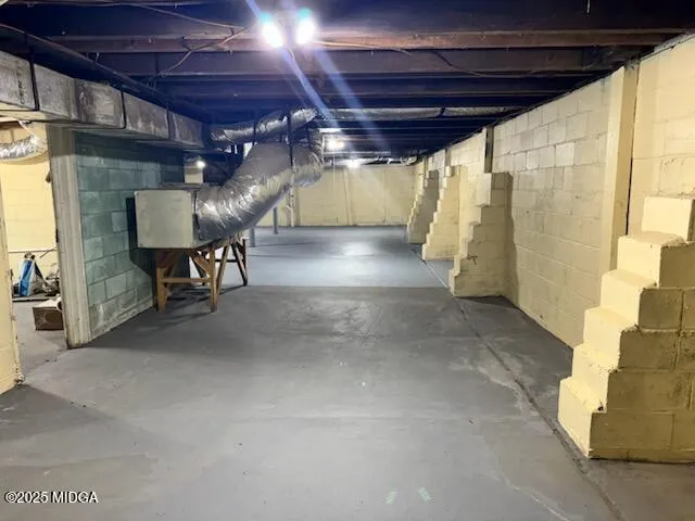 a view of an empty room with windows