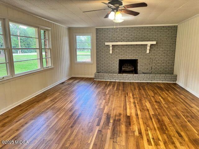 4912 Old Gordon Road Dry Branch, GA 31020 - Photo 9 of 32 a view of an empty room with wooden floor and a window