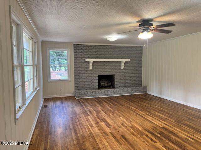 4912 Old Gordon Road Dry Branch, GA 31020 - Photo 10 of 32 a view of an empty room with wooden floor and a window