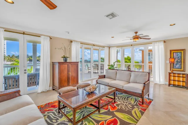 a kitchen with stainless steel appliances granite countertop sink stove and refrigerator